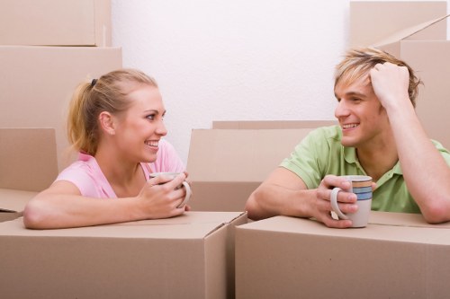 Careful wrapping of fragile belongings for moving day
