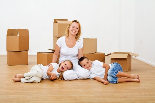 Mover assessing a bulky item before lifting and transport