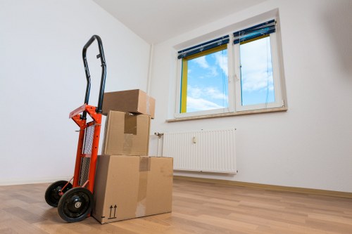 Staff preparing labelled boxes and office items for a business move