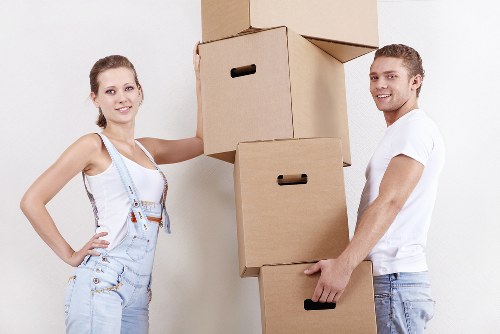 Professional movers organizing boxes in a moving truck
